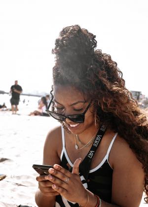 Rosie's Girl Texting on Dog Beach--Long Beach--United States Photo by kevin turcios on Unsplash