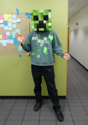 Staff member dressed as a creeper from Minecraft